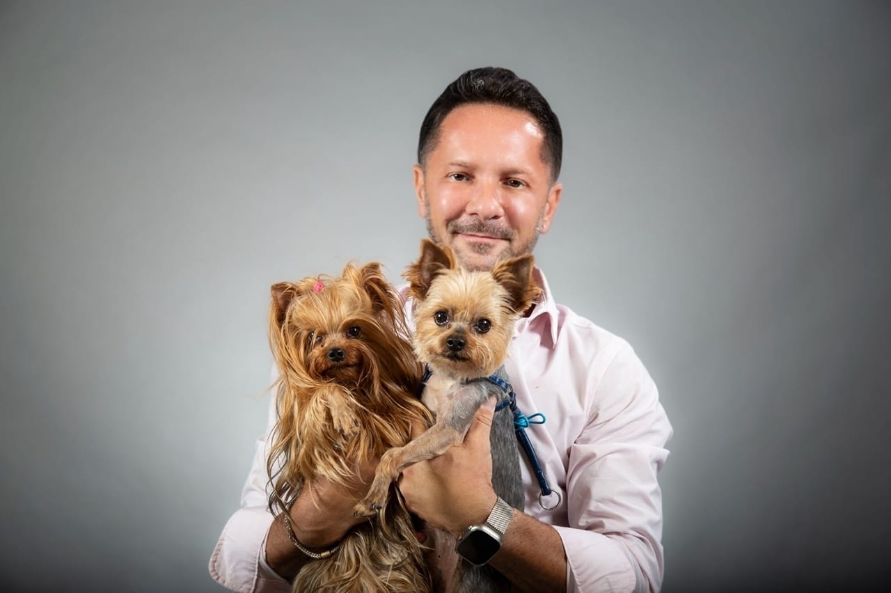 A licensed professional from PetVax examining a pet.
